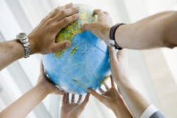 Globe supported by hands